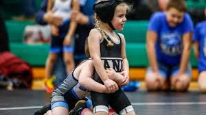 Young girl wrestler competing